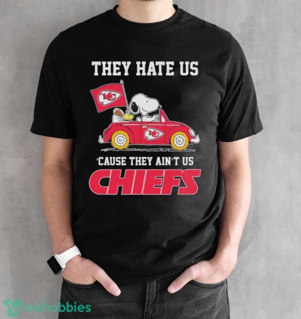 Official Peanuts Snoopy And Woodstock Driving Car Kansas City Chiefs The Y Hate Is ’cause They Ain’t Us Shirt - Black Unisex T-Shirt