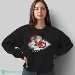 Funny Santa Kansas City Chiefs logo light Christmas Shirt image Funny Santa Kansas City Chiefs logo light Christmas Shirt - Sweatshirt